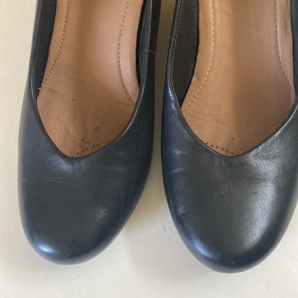 Black wedge heels by Clark’s